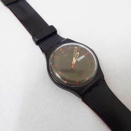 Men's Watches Swatch Gaet mens watch Red and black working some scratches was listed for